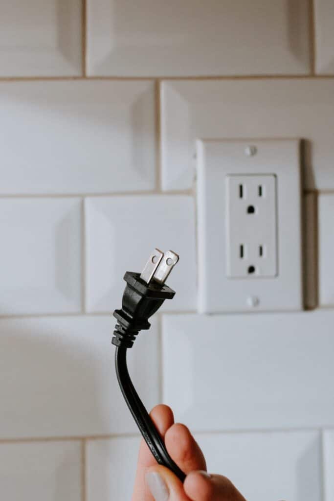 image of an outlet and plug without smart home technology